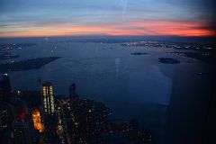 47 Governors Island, Battery Park, 50 West St, Hudson River, Statue Of Liberty From One World Trade Center Observatory After Sunset.jpg
